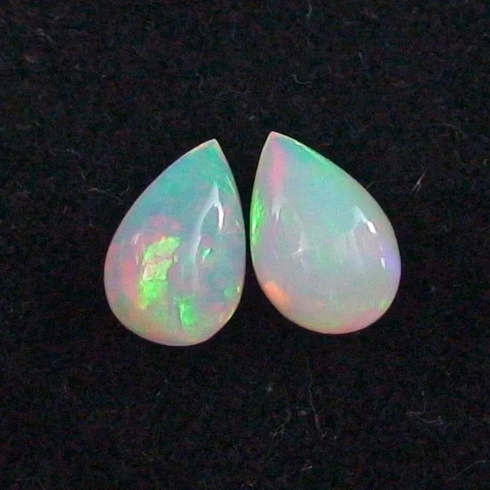 🦚 Welo Opal Pärchen 1,58 u. 1,84 ct Multicolor Milchopale Opale